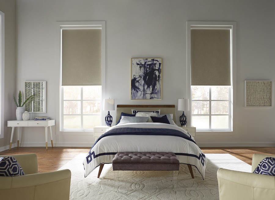 A bedroom with Lutron motorized shades.