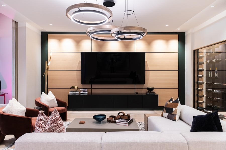  LED light fixtures provide modern lighting in a media room.