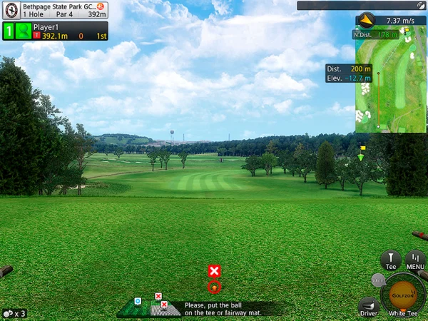 A golf simulator setup featuring a powerful projector and detailed golf course visuals.